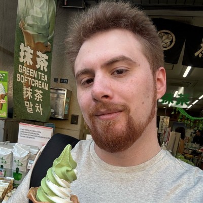 Alan Bishop holding a matcha soft serve